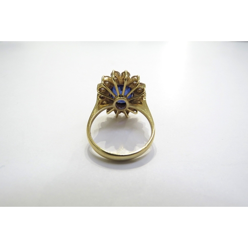 9055 - A sapphire and diamond cluster ring the central oval sapphire 11.5mm x 8.5mm, 3.47ct approx set in f... 