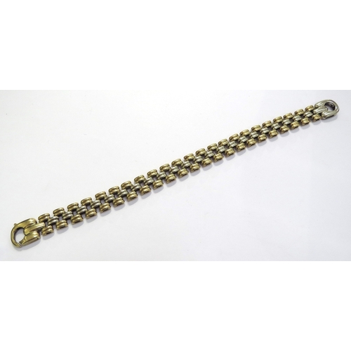 9067 - An 18ct two tone gold brick link flexible bracelet, 20cm long, 35.6g