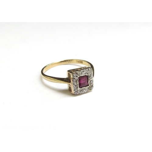 9069 - An 18ct gold platinum set ruby and diamond ring in square setting. Size H, 1.5g