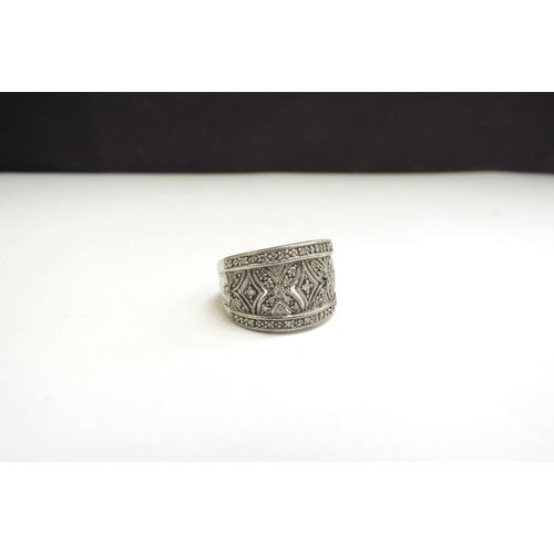 9128 - A silver ring with pierced diamond set basket, stamped 925, 0.25ct total diamonds. Size M, 5.3g   (R... 