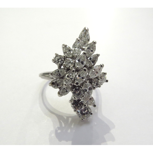 9297 - A diamond cluster ring, 21 diamonds comprising of pear cut, marquise cut and round brilliant cut dia... 