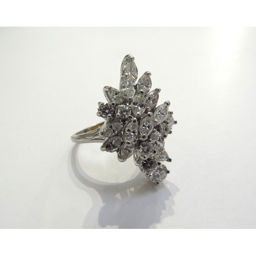 9297 - A diamond cluster ring, 21 diamonds comprising of pear cut, marquise cut and round brilliant cut dia... 