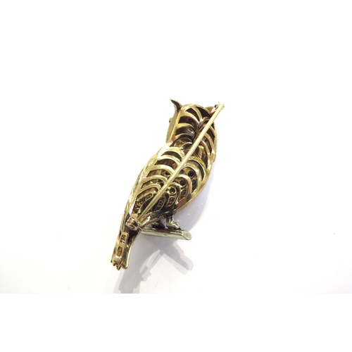 9447 - A late 20th Century 18ct gold diamond and sapphire brooch as an owl, marked 750, 5.5cm long, 20g