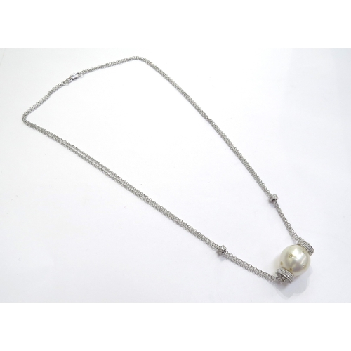 9445 - A white gold double trace chain link necklace with cultured pearl studded with diamonds and diamond ... 