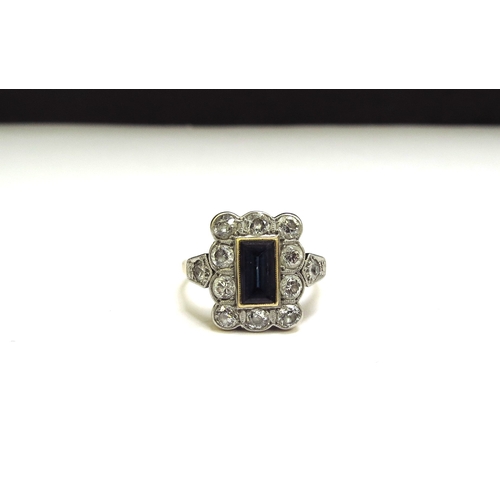 9441 - An 18ct/plat set Art Deco sapphire and diamond ring, the rectangular sapphire 7mm x 4mm framed by 10... 