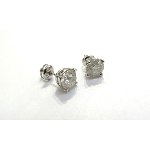 9351 - A pair of diamond stud earrings 1.15ct each approx in four claw white gold setting, stamped 14k, 1.6... 