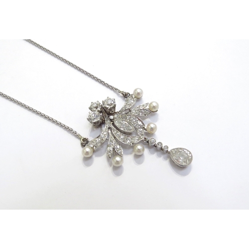 9426 - An early 20th Century diamond and pearl cluster pendant necklace with pear cut diamond droplet 0.50c... 