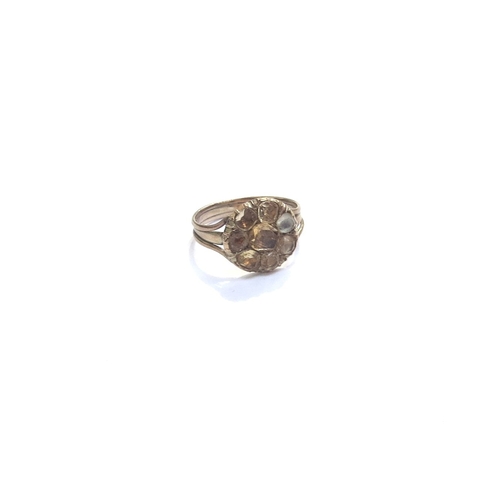 9231 - An unmarked gold ring with citrine set flower. Size M, 2.6g