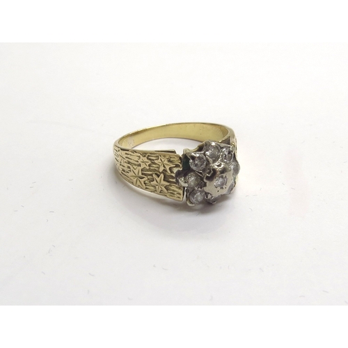 9341 - An 18ct gold diamond daisy ring with ivy leaf decoration to shoulders. Size S, 7.3g            (C)