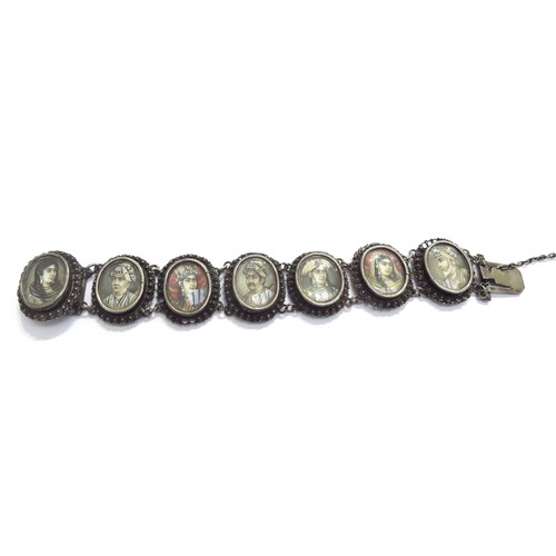 9444 - A white metal Indian ivory portrait bracelet depicting seven Mughals in oval panels, the names engra... 