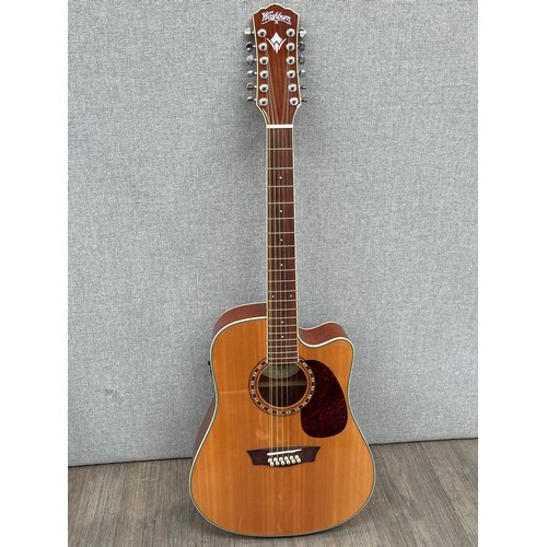 5164 - A Washburn WD10SCE12 12 string electro acoustic guitar, single cutaway, serial number SC16010136, ma... 