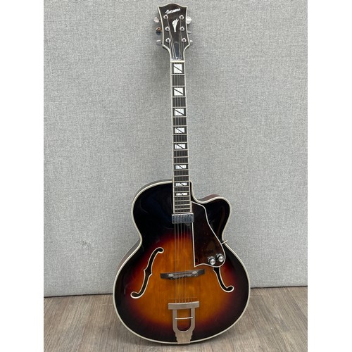 5165 - A Norseman semi-acoustic jazz guitar, sunburst body, raised pickguard with volume and tone knobs, so... 