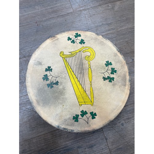 5089 - A Bodhran drum, harp and foliate design to skin, together with beater