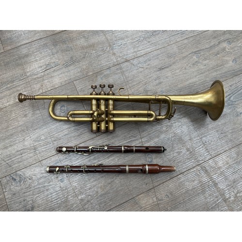 5077 - A Lincoln by Selmer brass trumpet (a/f) together with a Henry Potter piccolo and an unbranded Flageo... 