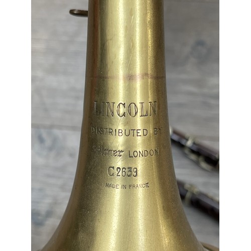 5077 - A Lincoln by Selmer brass trumpet (a/f) together with a Henry Potter piccolo and an unbranded Flageo... 
