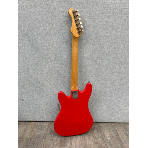 5114 - A 1960's Vox Shadow electric guitar in the Stratocaster style, fiesta red equivalent body, with hard... 