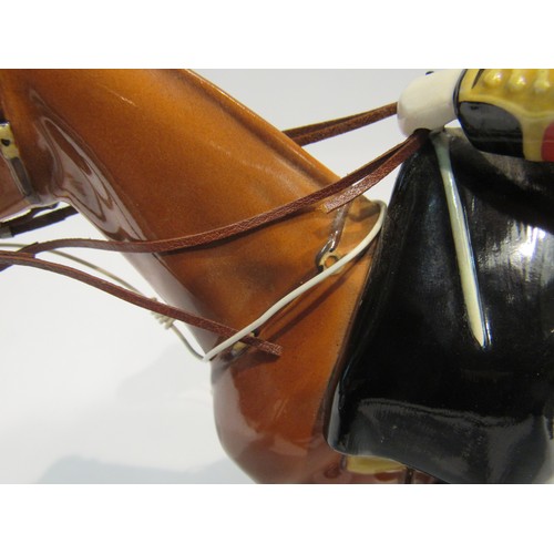 8126 - A Beswick figure of H.M. Queen Elizabeth II on Imperial horse, in chestnut gloss, model no. 1546, (l... 