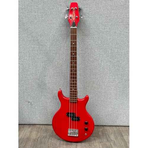 5117 - An electric bass guitar, red body, unbranded, possibly Japanese made