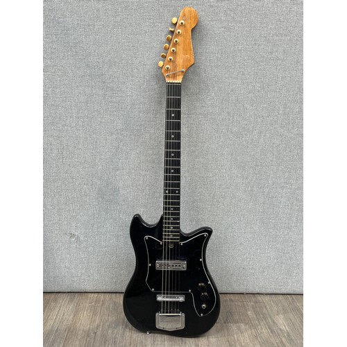 5118 - A 1960's Kay electric guitar, black body, chrome hardware
