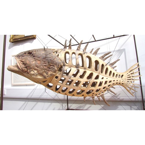 7064 - A late 20th Century ceramic sculptural figure of a Grouper fish, suspended diagonally by metal wires... 