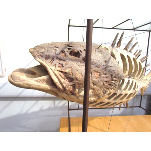 7064 - A late 20th Century ceramic sculptural figure of a Grouper fish, suspended diagonally by metal wires... 