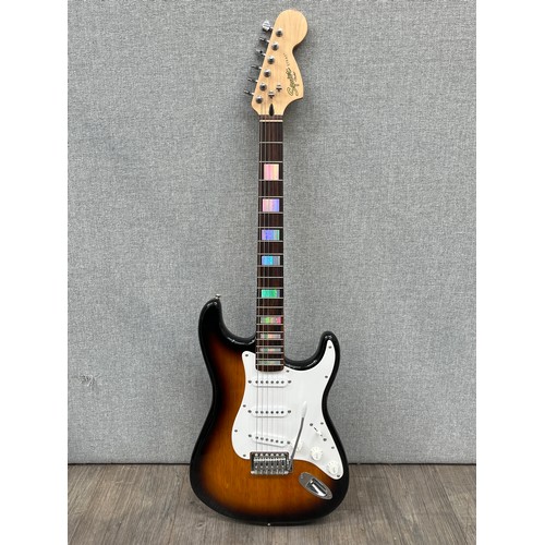 5120 - A Fender Squier Strat electric guitar, Indonesian, sunburst body, serial no. ICS14261883