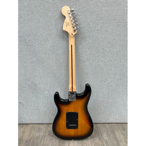 5120 - A Fender Squier Strat electric guitar, Indonesian, sunburst body, serial no. ICS14261883