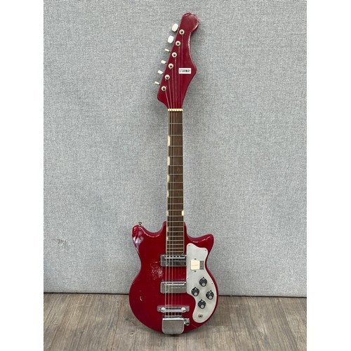 5121 - A 1960's Starway electric guitar with red body and chrome hardware, fitted case