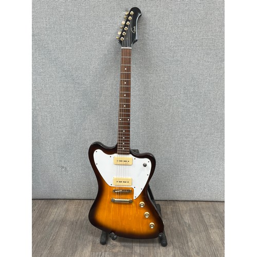 5125 - A Gould Stormbird style electric guitar with two tone sunburst body, white guard, fitted case