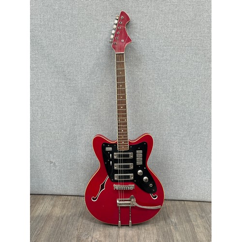 5126 - A 1960's Czechoslovakian Jolana Tornado Special electric guitar, red body, twin f-holes to hollowbod... 