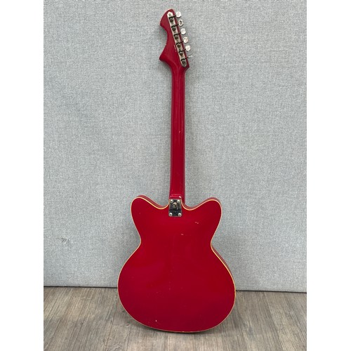 5126 - A 1960's Czechoslovakian Jolana Tornado Special electric guitar, red body, twin f-holes to hollowbod... 