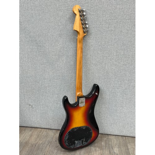 5128 - A 1970's Guyatone Stratocaster style electric guitar, sunburst body with off-white guard, with beatb... 