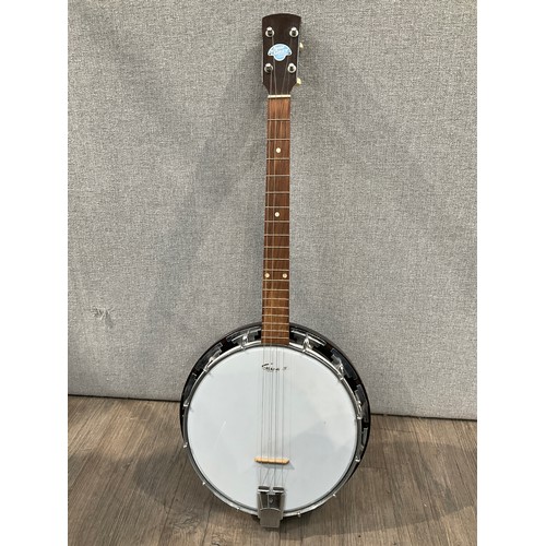 5171 - A John Grey & Sons of London four string banjo, closed back, cased