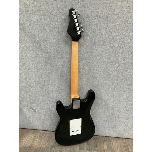 5181 - A Stratocaster style electric guitar, sunburst body, tortoiseshell effect guard