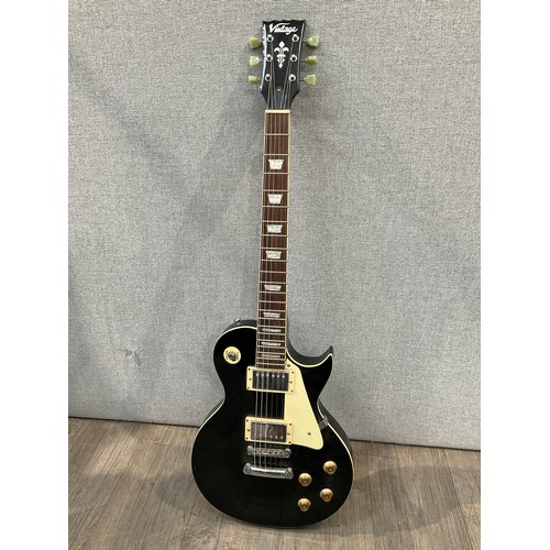 5109 - A JHS 'Vintage' V100 Les Paul style electric guitar, black body, serial number 14030822, with Epipho... 