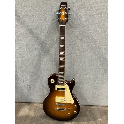 5106 - An Aria Pro II Les Paul style electric guitar, sunburst body, with brown leather effect fitted case