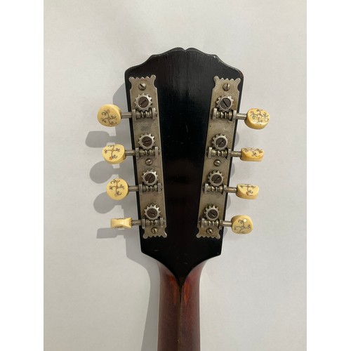 5001 - An early 20th Century Gibson A4 mandolin, teardrop form with mother of pearl inlay to headstock, ivo... 