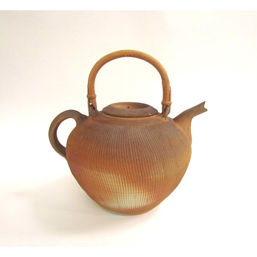 7115 - THIEBAUT CHAGUE (French b.1958): A studio pottery stoneware teapot of large proportions, cane handle... 