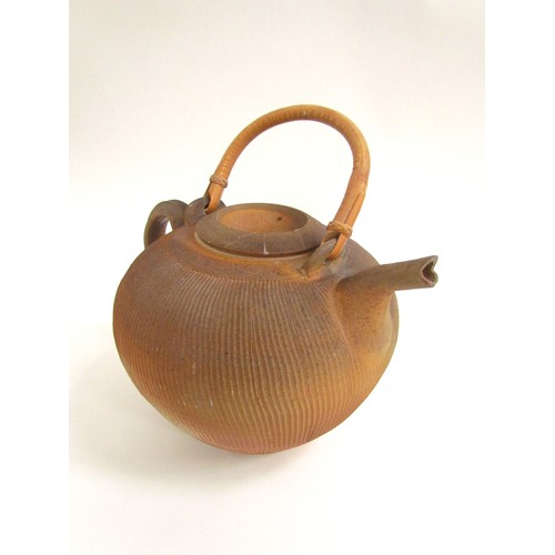 7115 - THIEBAUT CHAGUE (French b.1958): A studio pottery stoneware teapot of large proportions, cane handle... 