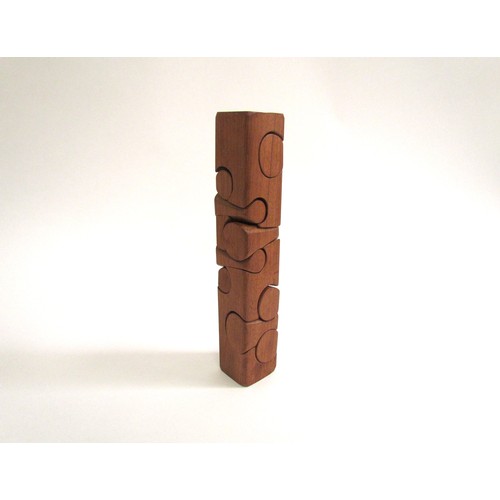 7548 - BRIAN WILLSHER (1930-2010) A teak puzzle tower. Unsigned, 26.5cm high x 4.7cm x 4.5cm    (C)