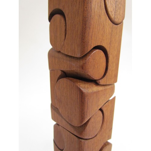 7548 - BRIAN WILLSHER (1930-2010) A teak puzzle tower. Unsigned, 26.5cm high x 4.7cm x 4.5cm    (C)