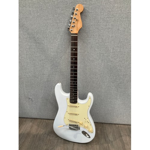 5203 - A Stratocaster style electric guitar in white