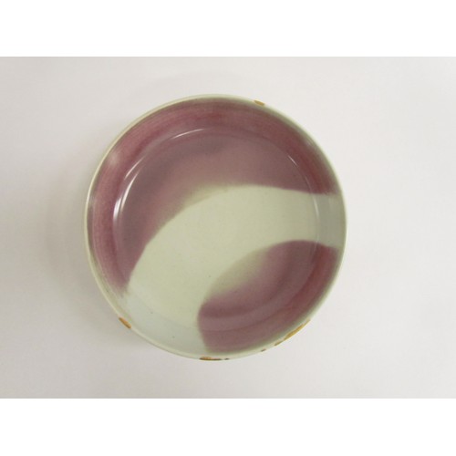 7114 - SHEILA CASSON (b.1930): A studio pottery shallow bowl with blush interior with wipe gold to rim, 25c... 