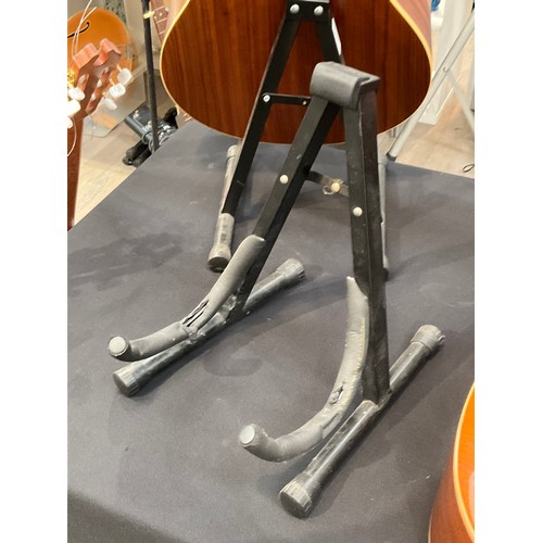 5237 - Five guitar stands (on acoustic table)