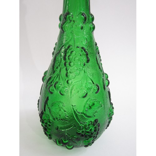 7151 - An Italian Empoli green glass bottle decanter and stopper with mould vine detail. Overall 54cm high