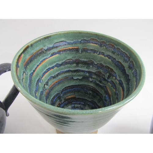 7139 - Three Jo Rollason items of studio pottery including blue mottled glazed teapot, cup and saucer and v... 