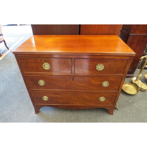 1092 - A 19th Century oak chest of two short over two long drawers, octagonal brass handles, on outswept br... 