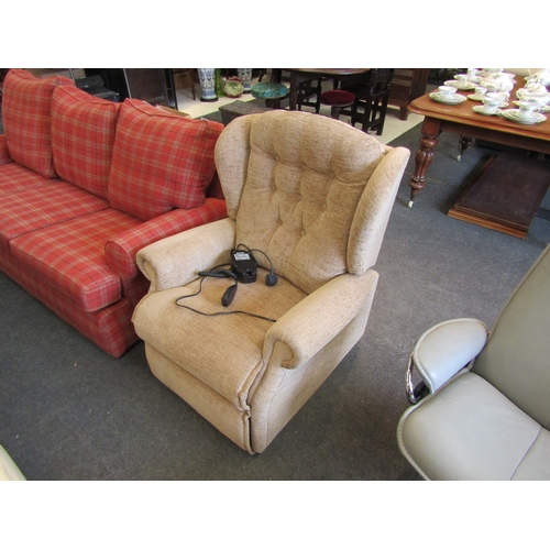 1125 - A Sherborne oatmeal upholstered electric rise and recline button back armchair