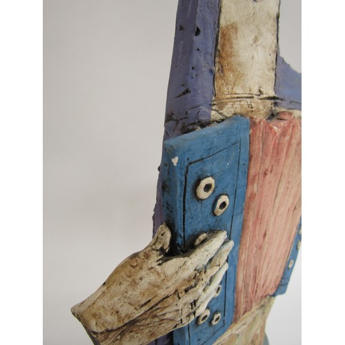 7057 - CHRISTY KEENEY (b.1958): A studio pottery figure of an accordian player, signed verso, 41.5cm high (... 