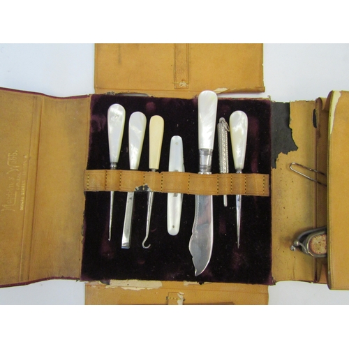 1305 - A Mappin & Webb red leather case containg sewing/lace making tools , a/f, with matched contents incl... 